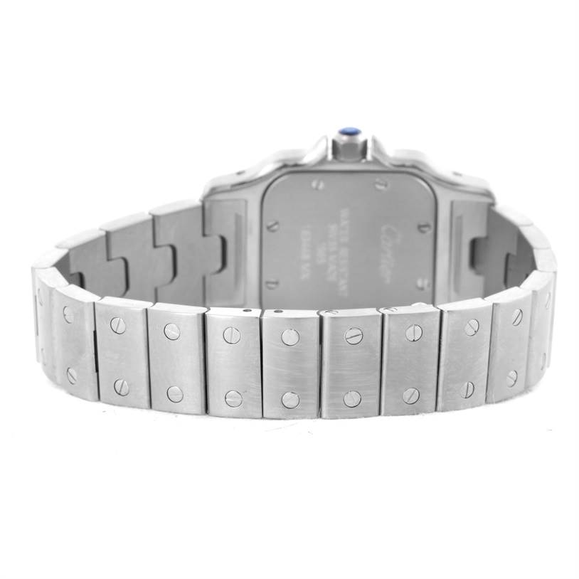 The image shows the back case and bracelet of the Santos model watch by Cartier at a rear angle.
