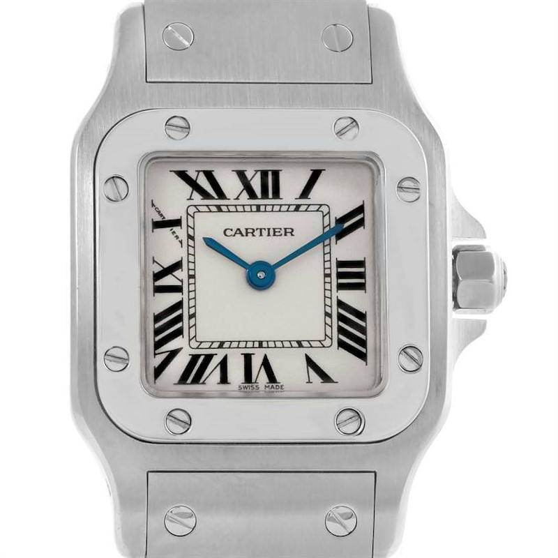 The image shows a frontal view of a Cartier Santos watch, highlighting its face, bezel, and part of the metal bracelet.