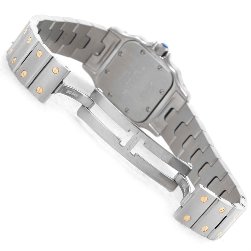 This image shows the underside of the Santos model by Cartier, highlighting the clasp and bracelet.
