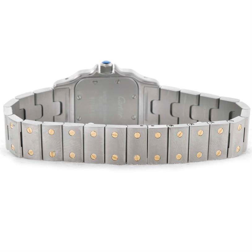 The image shows the rear view of the stainless steel bracelet of a Cartier Santos W20012C4 Women
s Stainless Steel Silver Dial W20012C4 Women
s Stainless Steel Silver Dial watch, featuring gold screws.