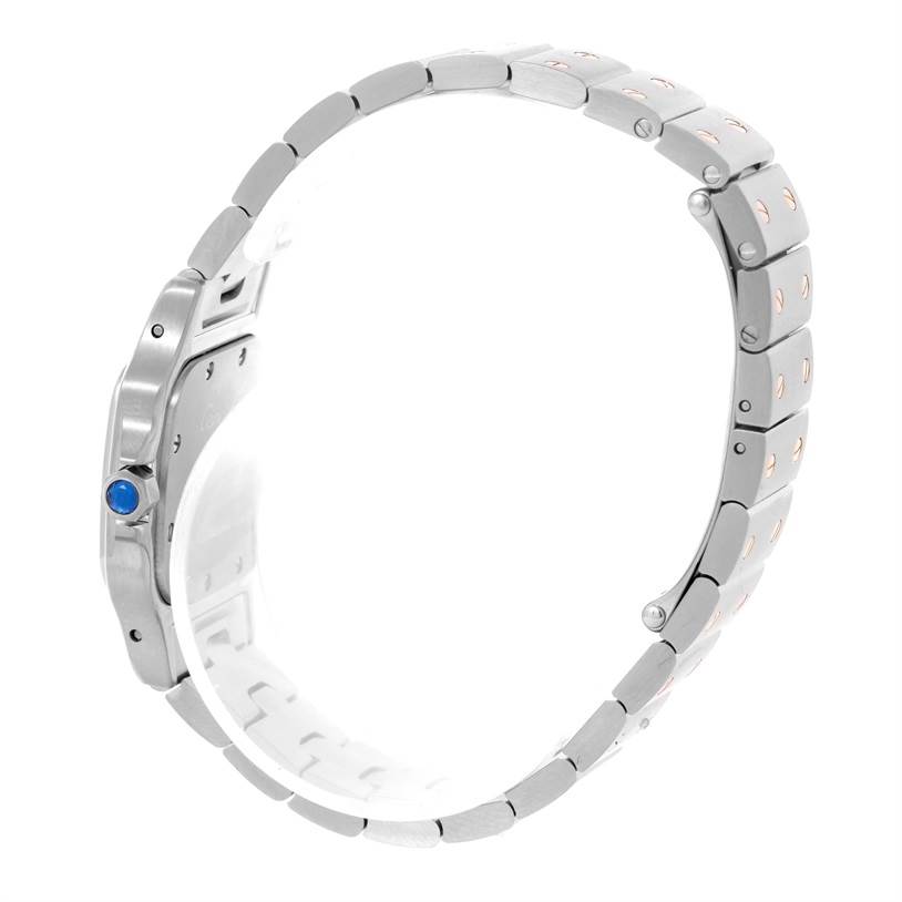 The image shows a side view of a Santos model watch by Cartier, highlighting its metal bracelet and crown.
