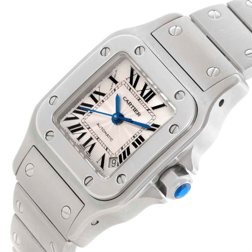 The image shows a close-up angle of a Cartier Santos W20054D6 Women
s Stainless Steel Silver Dial W20054D6 Women
s Stainless Steel Silver Dial watch, highlighting the face, crown, and part of the bracelet.