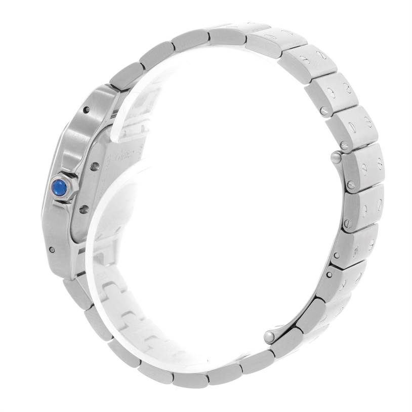 The image shows a side profile view of the Cartier Santos W20054D6 Women
s Stainless Steel Silver Dial W20054D6 Women
s Stainless Steel Silver Dial watch, highlighting the bracelet and crown with a blue gemstone.