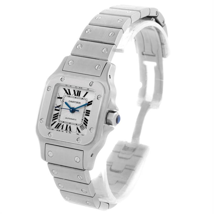 The Cartier Santos W20054D6 Women
s Stainless Steel Silver Dial W20054D6 Women
s Stainless Steel Silver Dial watch is shown at a slight angle, displaying its face, bezel, crown, and metal bracelet.