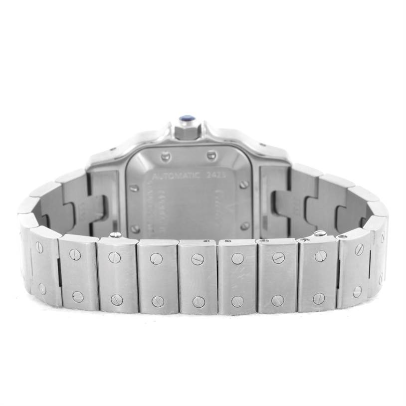 The image shows the back and bracelet of a Santos model Cartier watch, focusing on the clasp and links.