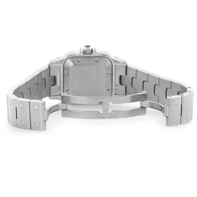 The image shows the open clasp and underside of the bracelet of a Santos watch by Cartier.