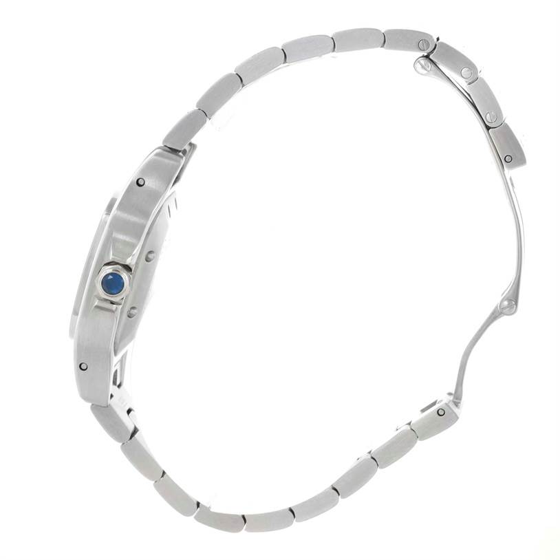 The image shows a side profile of the Cartier Santos W20054D6 Women
s Stainless Steel Silver Dial W20054D6 Women
s Stainless Steel Silver Dial watch, highlighting its case, crown, and part of the bracelet.