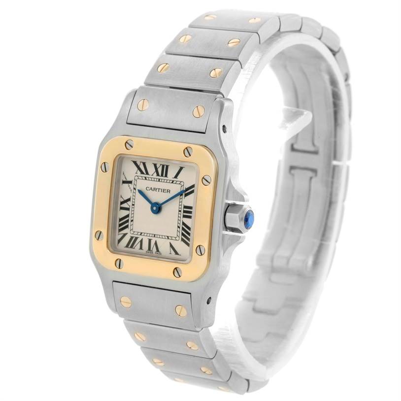The image shows a Cartier Santos W20012C4 Women
s Stainless Steel Silver Dial W20012C4 Women
s Stainless Steel Silver Dial watch at an angle, displaying its face, bezel, and bracelet with visible screws.