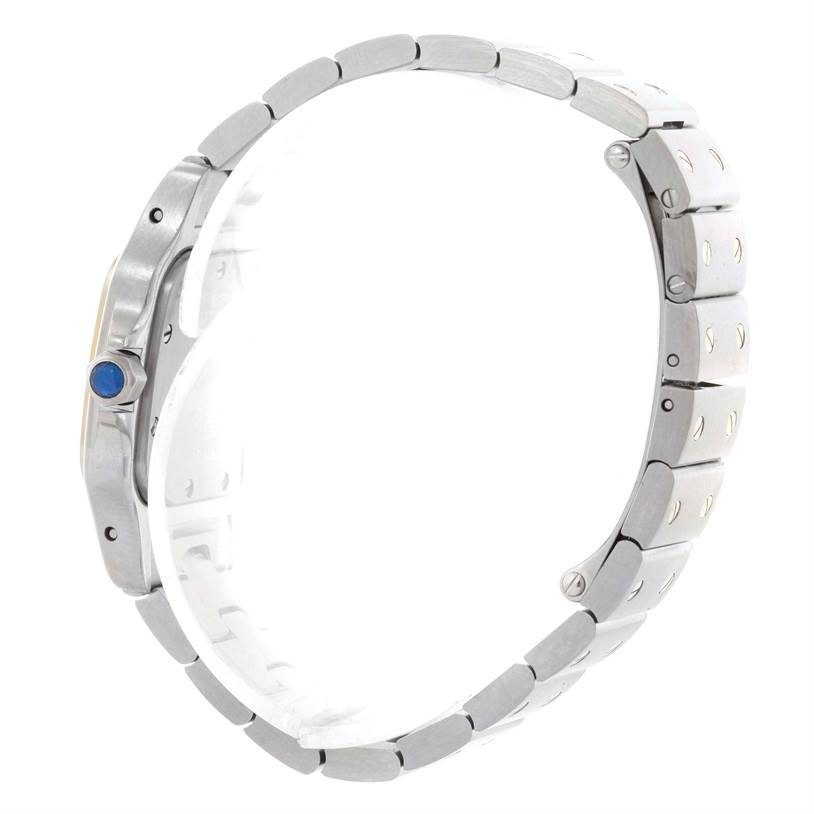 The image shows a side profile of the Cartier Santos W20012C4 Women
s Stainless Steel Silver Dial W20012C4 Women
s Stainless Steel Silver Dial watch, highlighting the bracelet and crown with a blue cabochon.