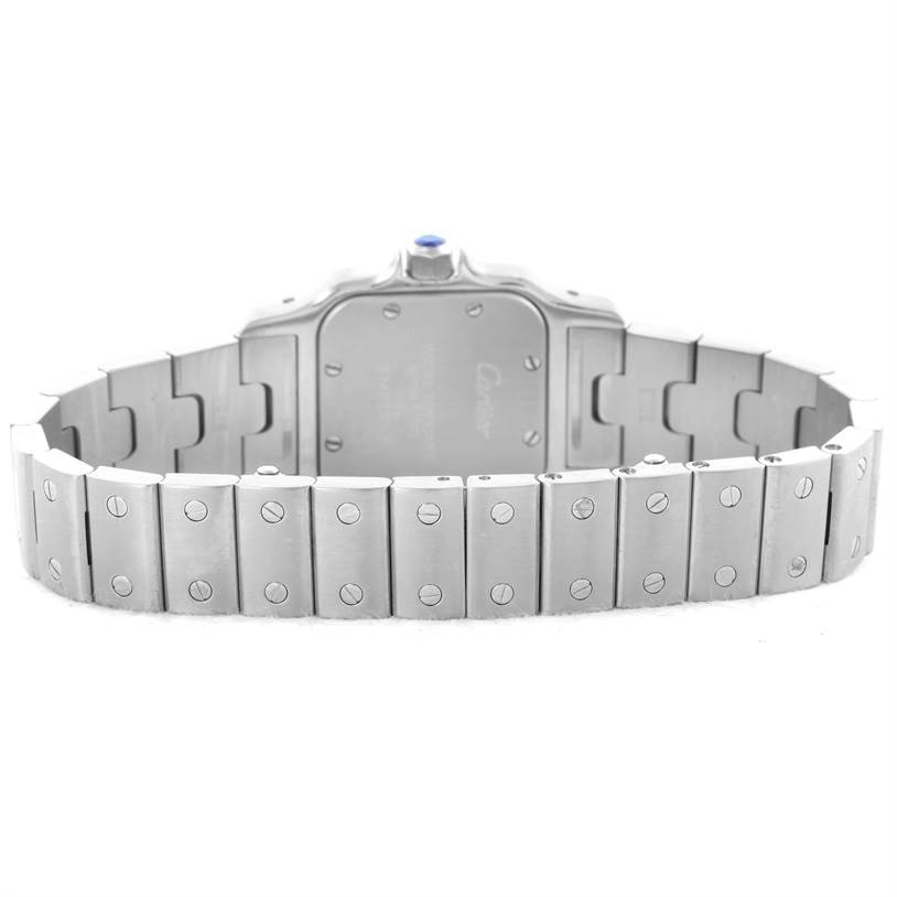 The back of the Santos watch by Cartier is shown, highlighting the case back, bracelet, and clasp.