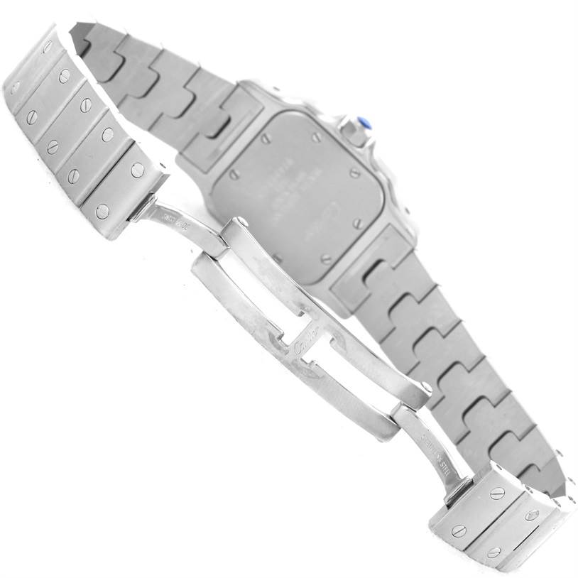 The image shows the back of the Santos model by Cartier, focusing on its clasp and stainless steel bracelet.