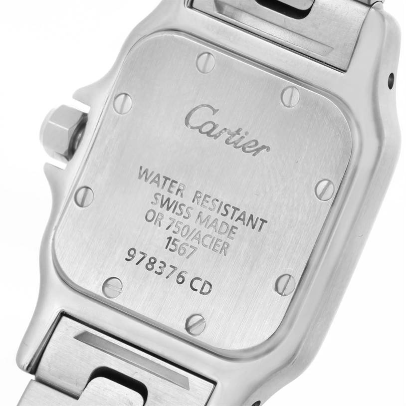 The image shows the backside of a Cartier Santos W20012C4 Women
s Stainless Steel Silver Dial W20012C4 Women
s Stainless Steel Silver Dial watch, highlighting the case back with engraved details.