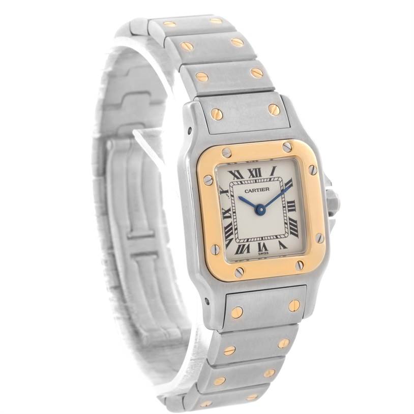 The image shows a side view of the Cartier Santos W20012C4 Women
s Stainless Steel Silver Dial W20012C4 Women
s Stainless Steel Silver Dial watch, highlighting the face, bezel, and segmented metal bracelet.