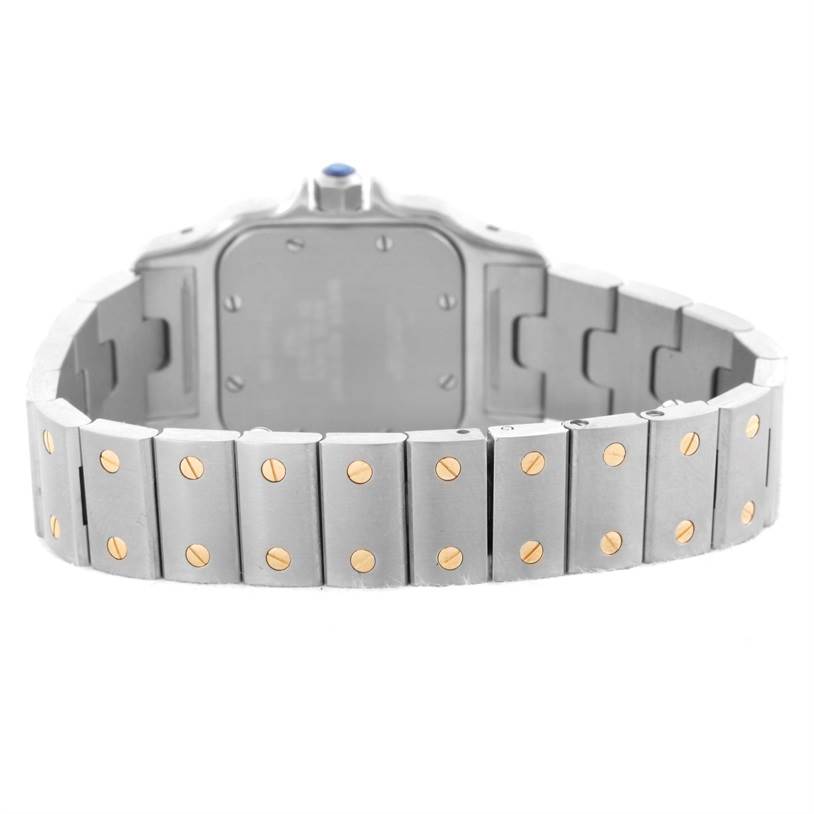 This image shows the back and metallic bracelet of the Santos model by Cartier, featuring distinctive screw details.