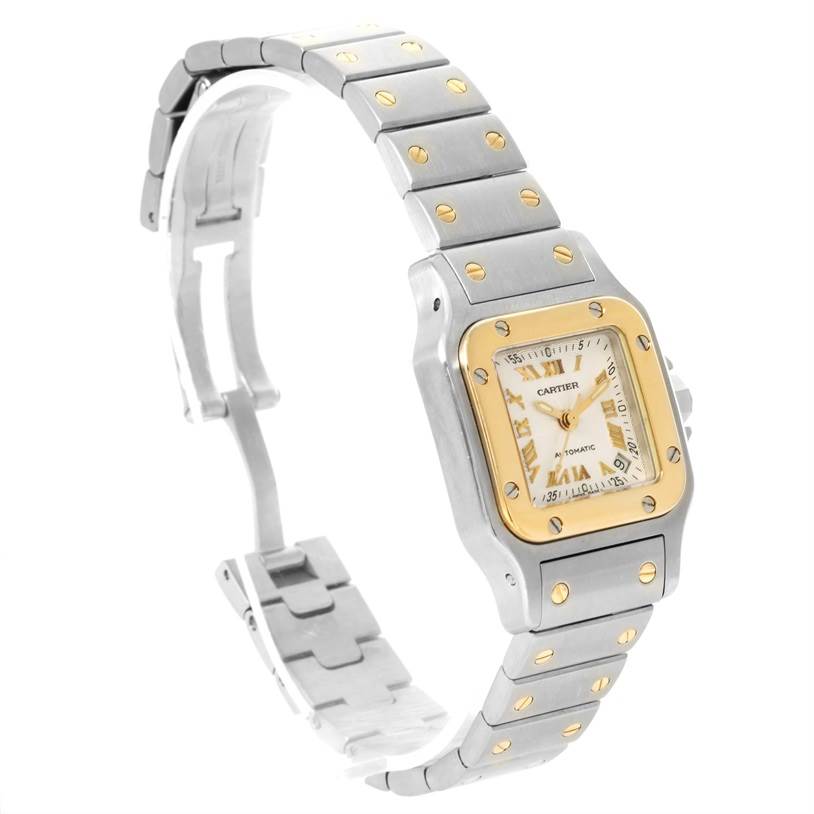 The image shows a side view of the Cartier Santos W20057C4 Women
s Stainless Steel Silver Dial W20057C4 Women
s Stainless Steel Silver Dial watch, highlighting the bracelet and watch face.