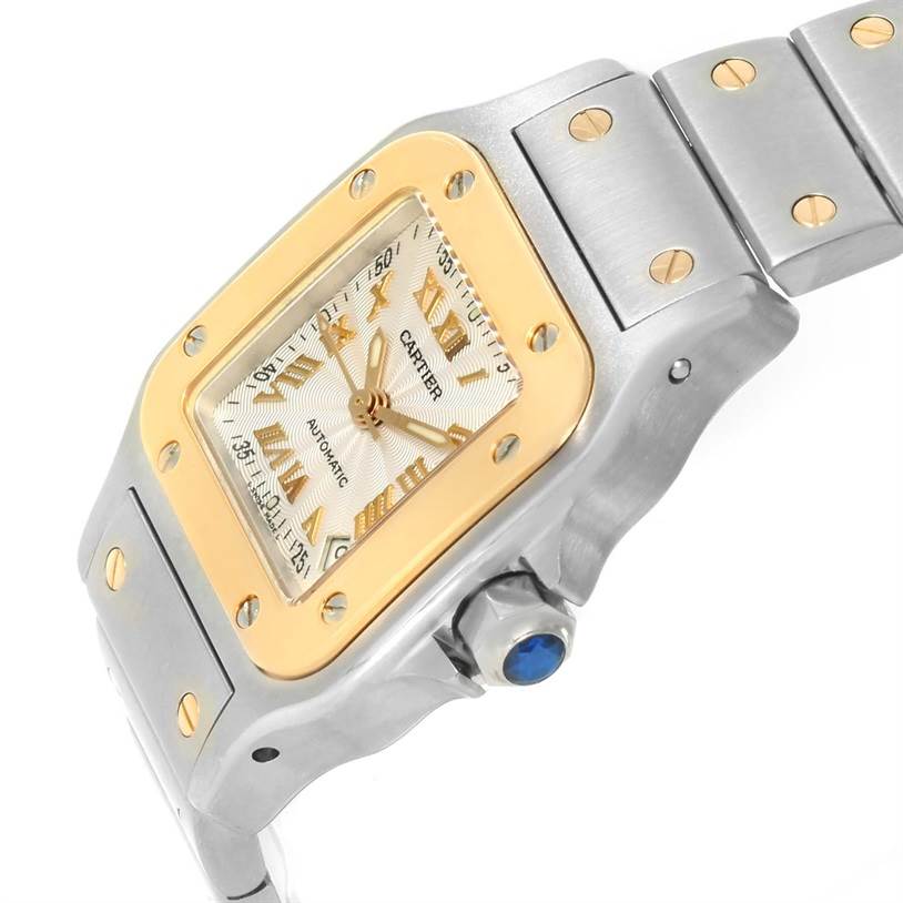 This image shows an angled view of the Cartier Santos W20057C4 Women
s Stainless Steel Silver Dial W20057C4 Women
s Stainless Steel Silver Dial watch, highlighting the bezel, dial, and part of the bracelet.