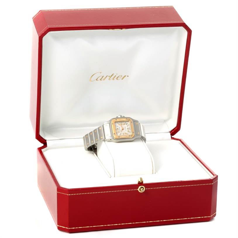 The Cartier Santos W20057C4 Women
s Stainless Steel Silver Dial W20057C4 Women
s Stainless Steel Silver Dial watch is displayed in an open box, showing the face and bracelet at a slight angle.