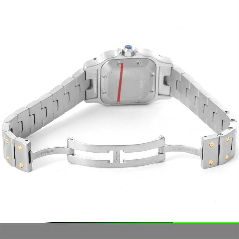The image shows the back and open clasp of a Cartier Santos W20057C4 Women
s Stainless Steel Silver Dial W20057C4 Women
s Stainless Steel Silver Dial watch, highlighting its stainless steel band and screws.