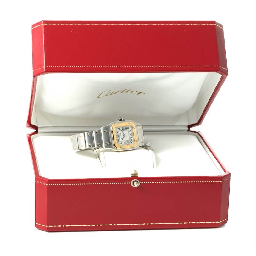 This image shows the Cartier Santos W20012C4 Women
s Stainless Steel Silver Dial W20012C4 Women
s Stainless Steel Silver Dial watch, displayed in an open red Cartier box, viewed from the front.