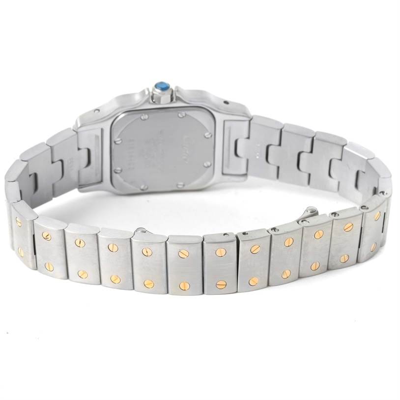 This image shows the back case and bracelet of a Santos model watch by Cartier.