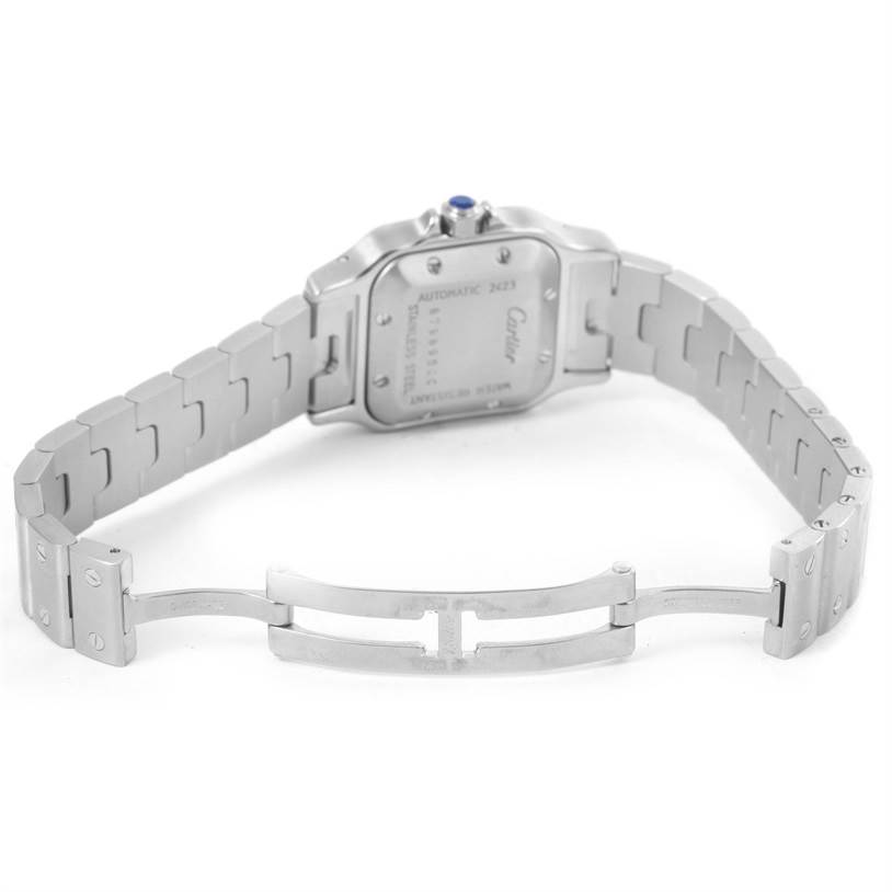 The image shows the back of a Cartier Santos W20044D6 Women
s Stainless Steel Silver Dial W20044D6 Women
s Stainless Steel Silver Dial watch, highlighting the case back and part of the bracelet.