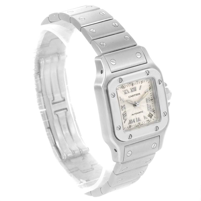 The image shows a Cartier Santos W20044D6 Women
s Stainless Steel Silver Dial W20044D6 Women
s Stainless Steel Silver Dial model watch at an angled view, highlighting its face, bezel, and metal band.