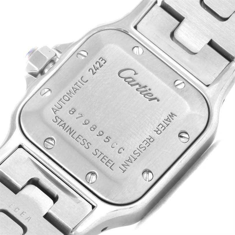 The image shows the backside and part of the bracelet of a Santos model watch by Cartier.