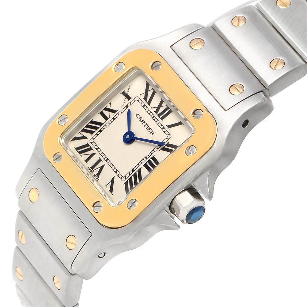 The image shows a close-up angle of the Cartier Santos W20012C4 Women's Stainless Steel Silver Dial W20012C4 Women's Stainless Steel Silver Dial watch face, bezel, and part of the bracelet.