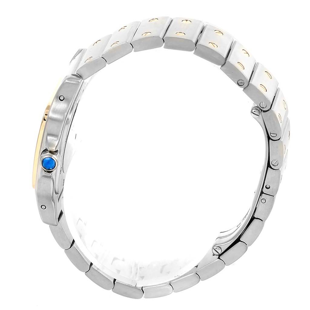 The image shows a side view of the Cartier Santos W20012C4 Women's Stainless Steel Silver Dial W20012C4 Women's Stainless Steel Silver Dial watch, highlighting its bracelet and blue cabochon crown.