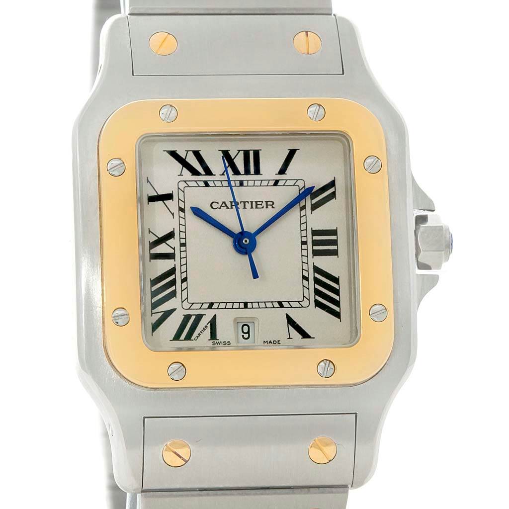 The image shows a front view of a Cartier Santos W20011C4 Stainless Steel Silver Dial W20011C4 Stainless Steel Silver Dial watch, highlighting the dial, bezel, and part of the bracelet.