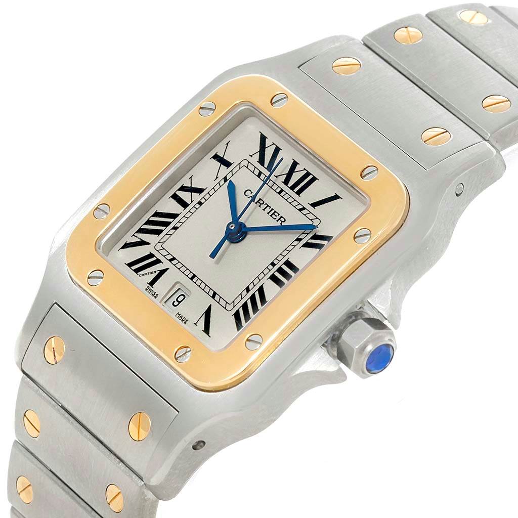 The angle shows the Santos model by Cartier from an upper-left perspective, highlighting the face, bezel, and part of the bracelet.
