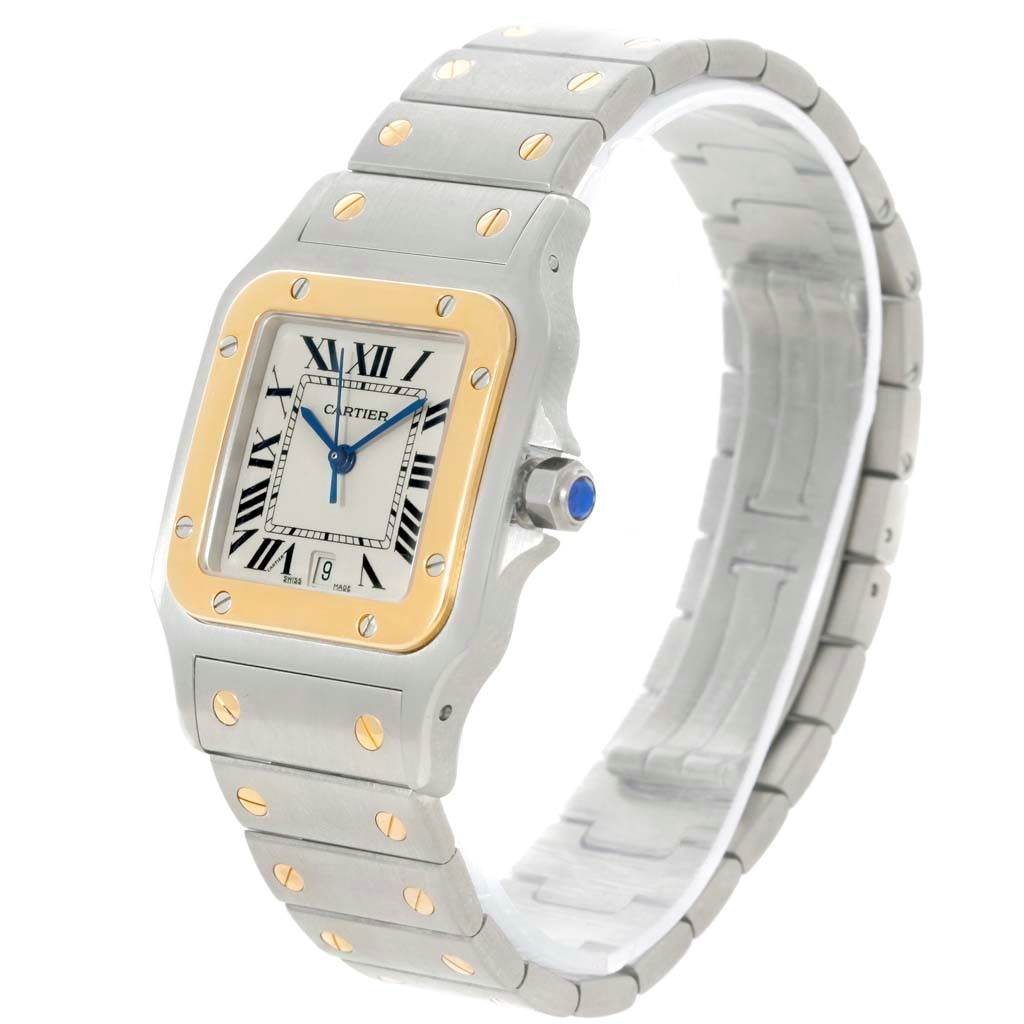 The Cartier Santos W20011C4 Stainless Steel Silver Dial W20011C4 Stainless Steel Silver Dial watch is shown at a three-quarter angle, displaying the face, bezel, band, and crown with a sapphire cabochon.