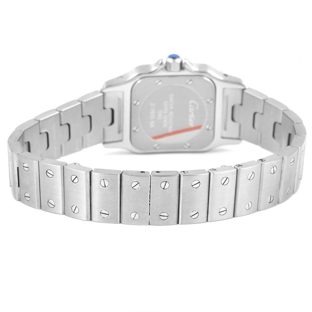 The image shows the back view of a Cartier Santos W20056D6 Women
s Stainless Steel Silver Dial W20056D6 Women
s Stainless Steel Silver Dial watch, highlighting its metal bracelet and clasp.