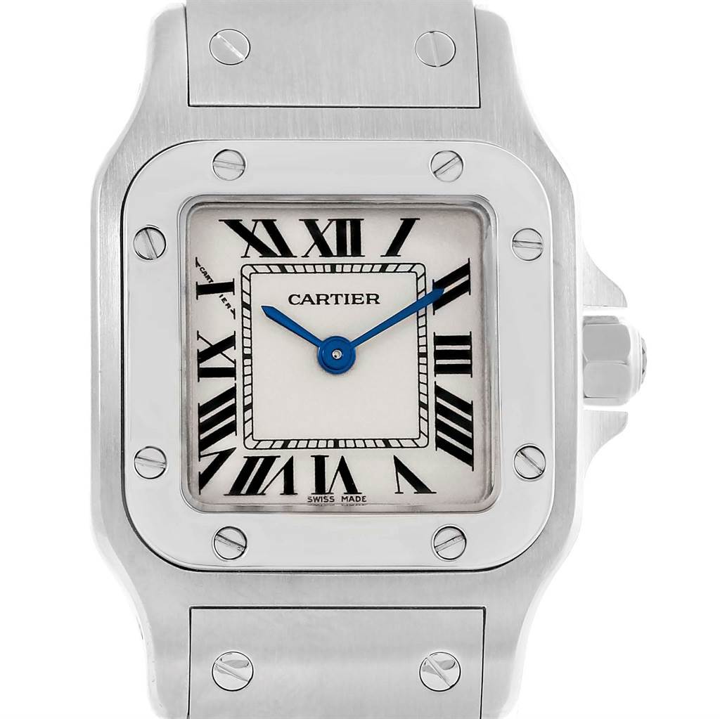 This Cartier Santos W20056D6 Women
s Stainless Steel Silver Dial W20056D6 Women
s Stainless Steel Silver Dial watch is shown from a front angle, highlighting its square face, Roman numerals, and screw-adorned bezel.