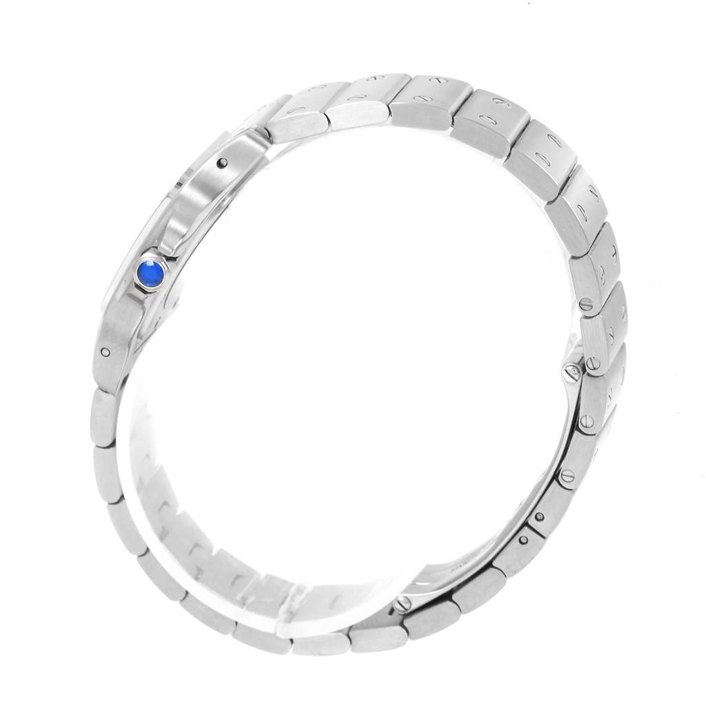 This image shows the side view of the bracelet and crown with a blue gem of the Cartier Santos W20056D6 Women
s Stainless Steel Silver Dial W20056D6 Women
s Stainless Steel Silver Dial watch.