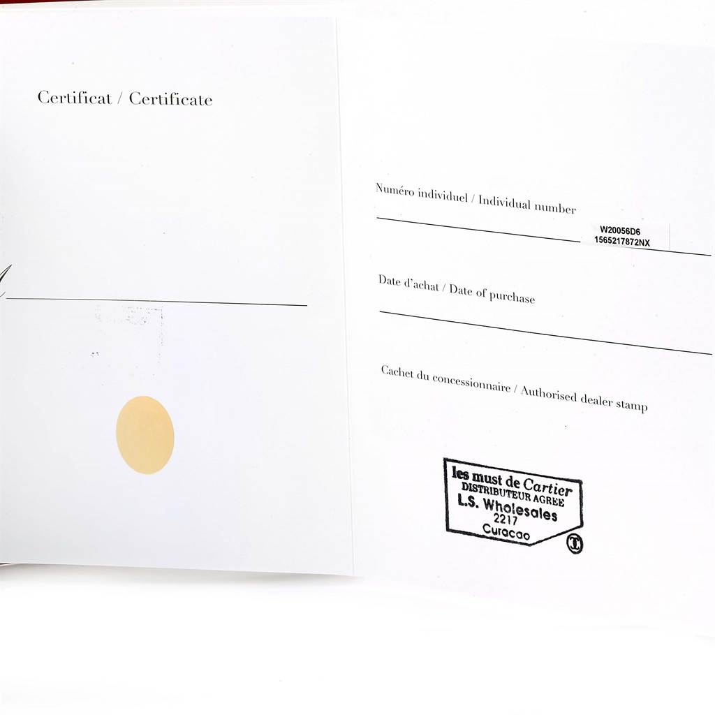 An open certificate booklet for the Santos model by Cartier shows individual number and authorized dealer stamp sections.