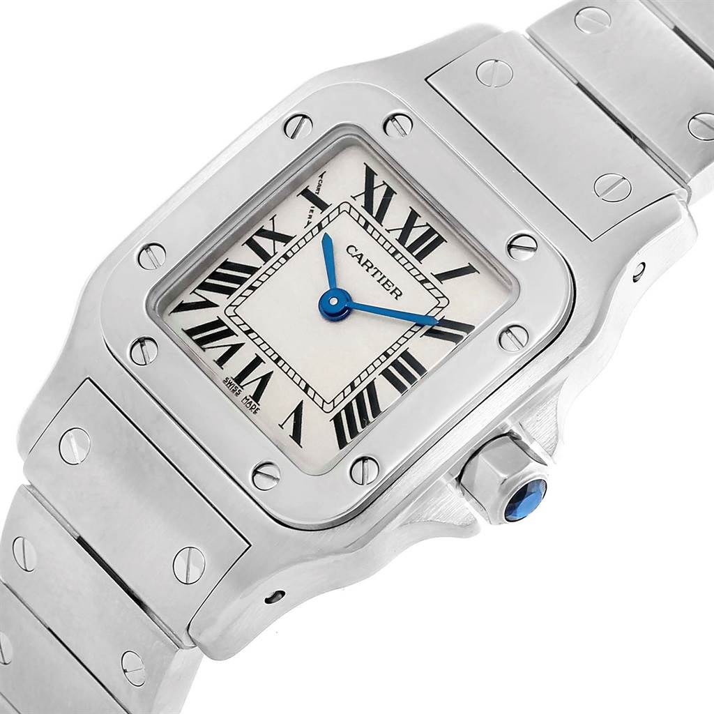 The image shows a close-up of the dial, bezel, and part of the bracelet of a Cartier Santos W20056D6 Women
s Stainless Steel Silver Dial W20056D6 Women
s Stainless Steel Silver Dial watch in a top-angle view.