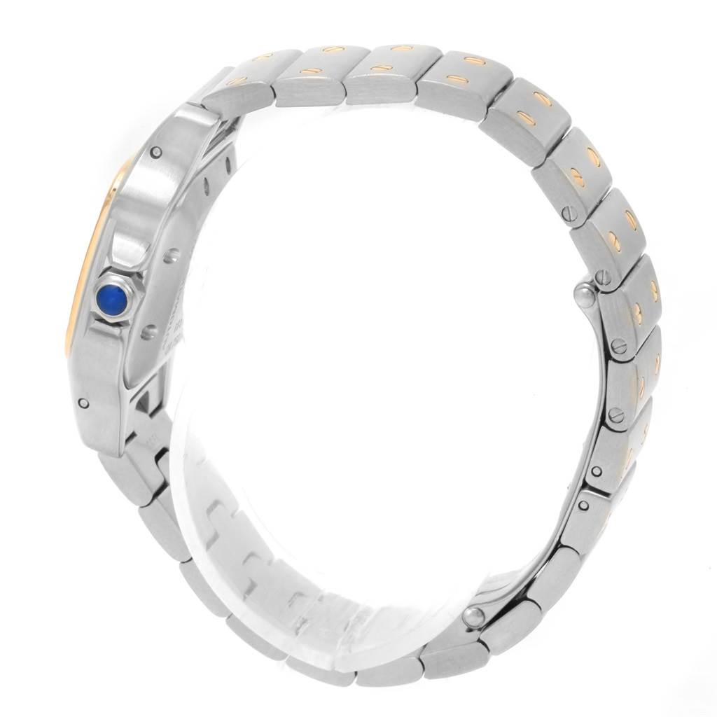 The image shows a Cartier Santos W20057C4 Women's Stainless Steel Beige Dial W20057C4 Women's Stainless Steel Beige Dial watch at a side angle, highlighting the metal bracelet and the blue crown.