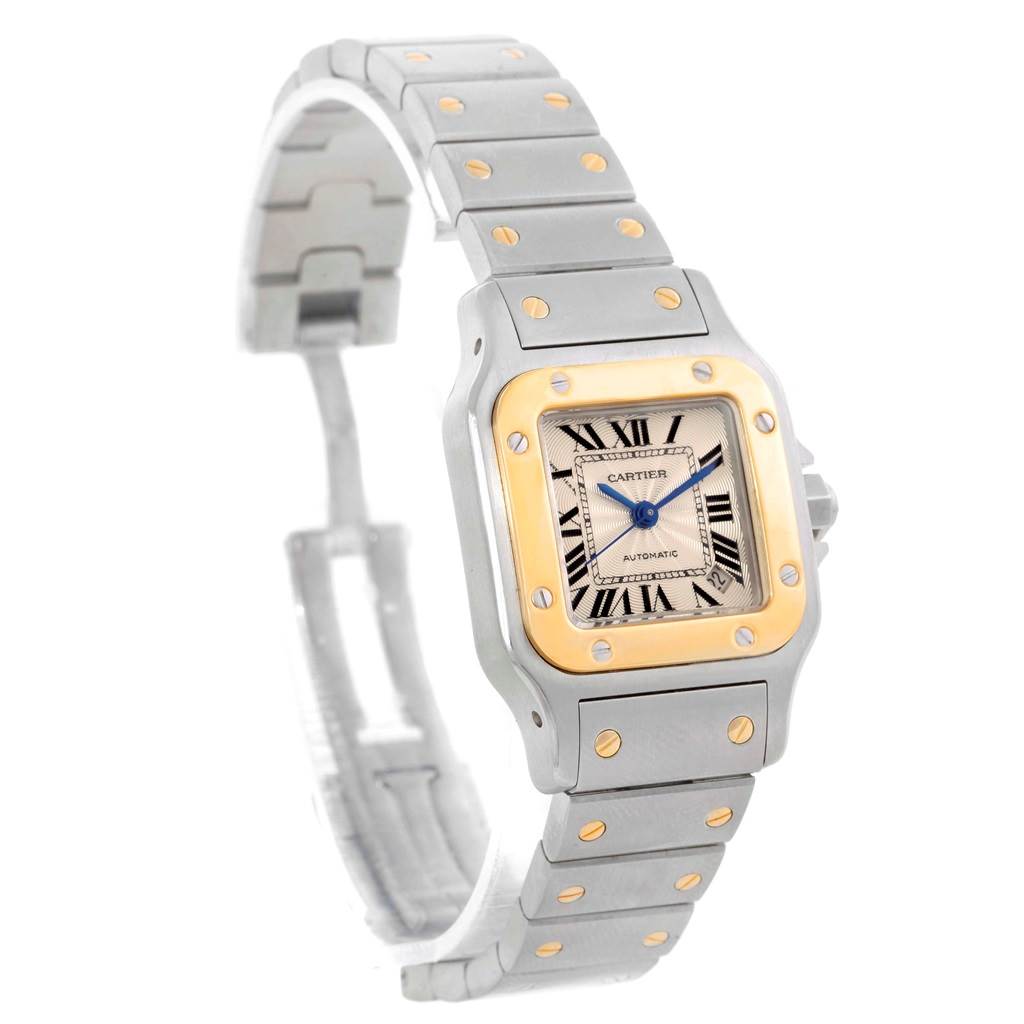 The image shows a front angle of the Cartier Santos W20057C4 Women's Stainless Steel Beige Dial W20057C4 Women's Stainless Steel Beige Dial watch, highlighting its face, bezel, and metal bracelet.