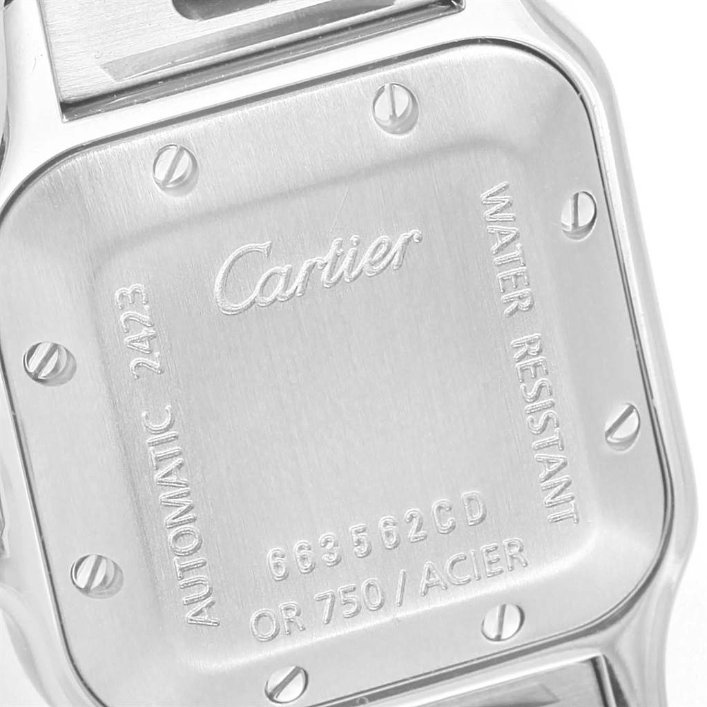 This image shows the case back of a Cartier Santos W20057C4 Women's Stainless Steel Beige Dial W20057C4 Women's Stainless Steel Beige Dial model watch, featuring engraved details and securing screws.