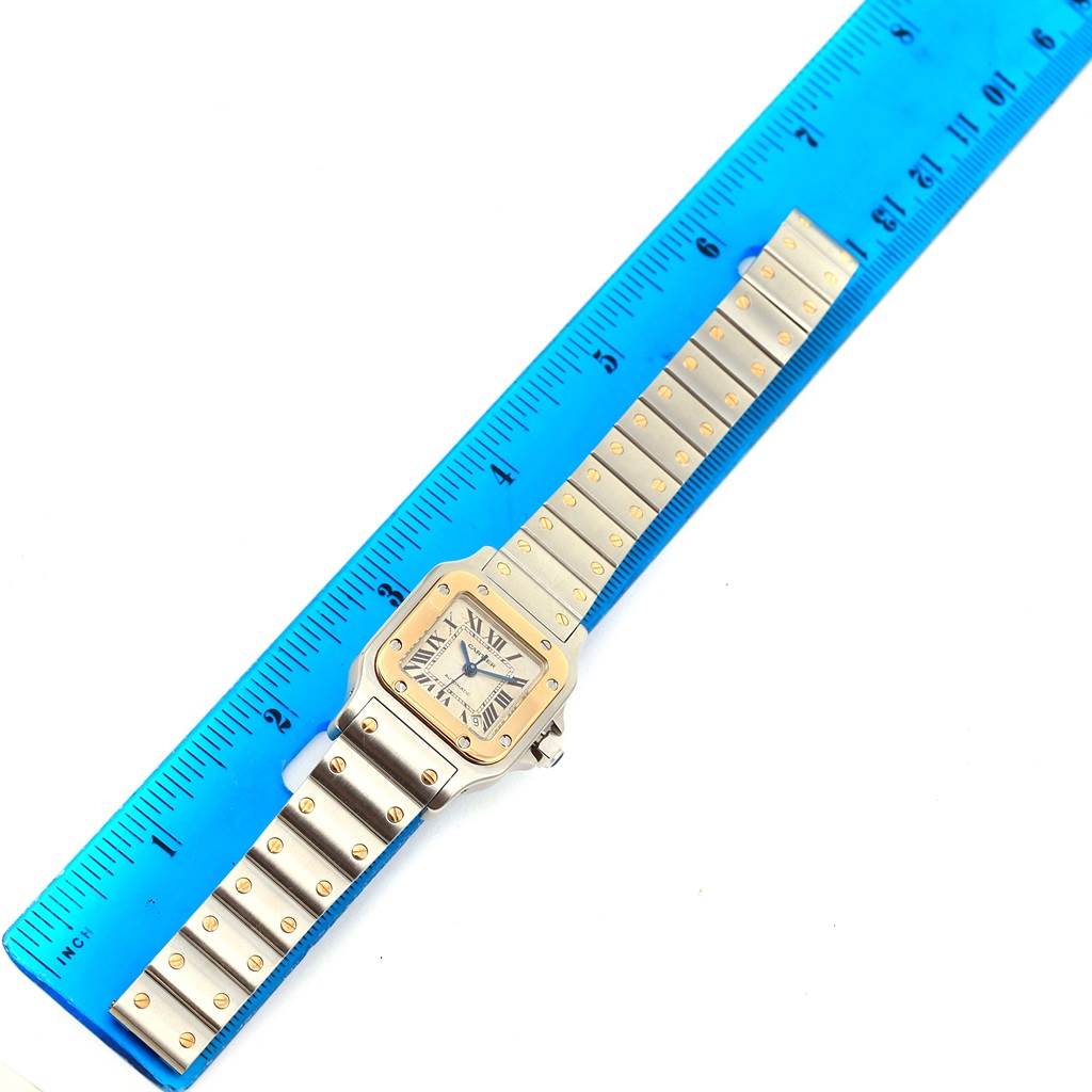 The image shows the Cartier Santos W20057C4 Women's Stainless Steel Beige Dial W20057C4 Women's Stainless Steel Beige Dial watch laid flat, measured with a blue ruler.