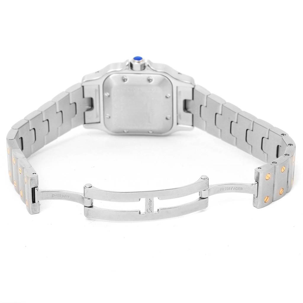 The image shows the Cartier Santos W20057C4 Women's Stainless Steel Beige Dial W20057C4 Women's Stainless Steel Beige Dial watch from the back, with its bracelet and clasp open, highlighting the caseback and bracelet links.