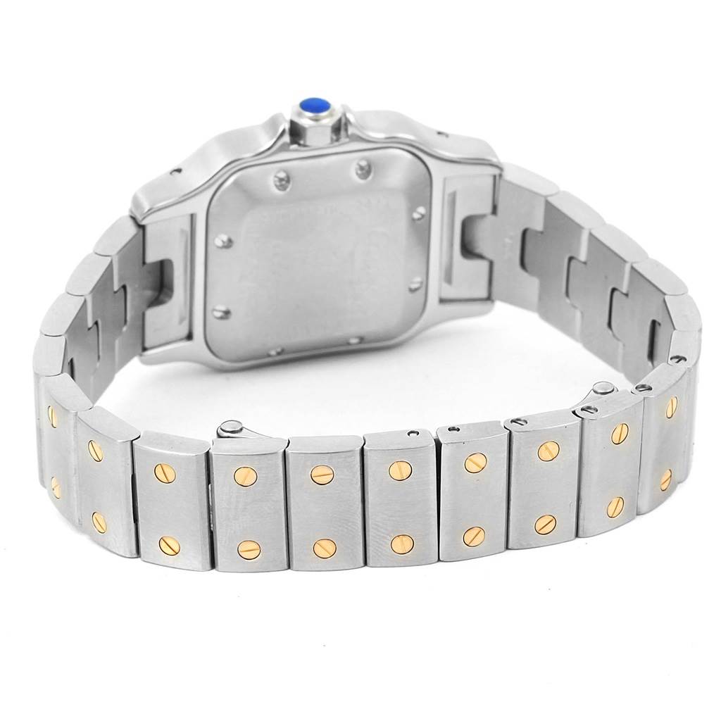 The image shows the back view and metal bracelet of the Santos model watch by Cartier.