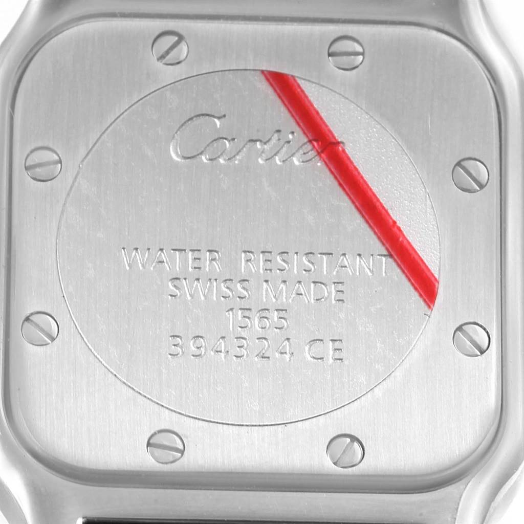 This image shows the engraved back casing of a Cartier Santos W20056D6 Women
s Stainless Steel Silver Dial W20056D6 Women
s Stainless Steel Silver Dial watch, detailing its water resistance and Swiss-made origin.