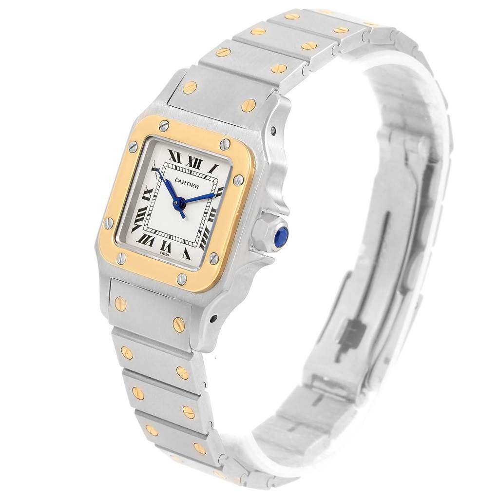 This Cartier Santos Women
s Stainless Steel Silver Dial Women
s Stainless Steel Silver Dial watch is shown from a three-quarter angle, highlighting the face, bezel, and bracelet.