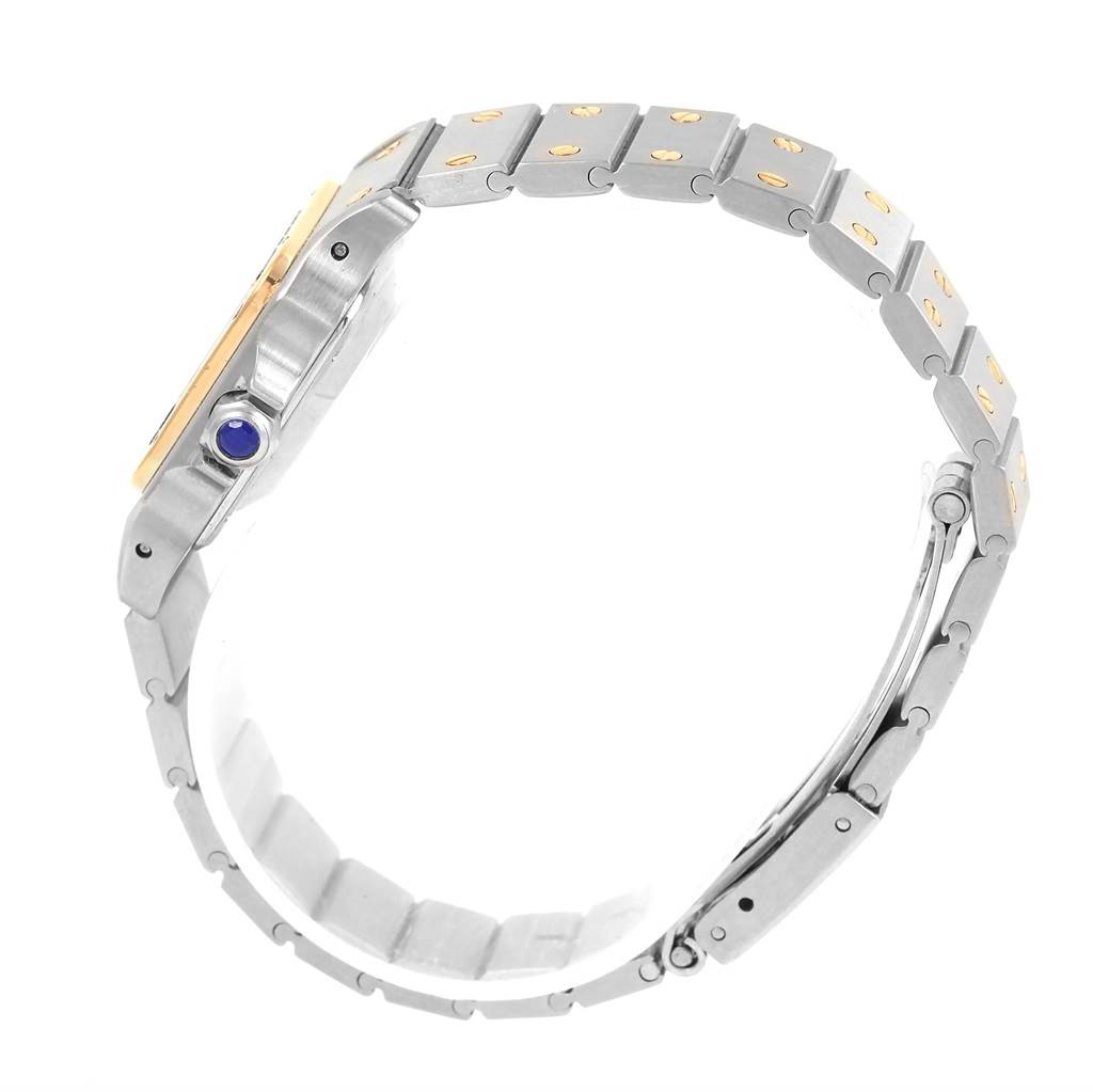 This image shows the side view of the Cartier Santos Women
s Stainless Steel Silver Dial Women
s Stainless Steel Silver Dial watch, highlighting its bracelet and crown with a blue cabochon.