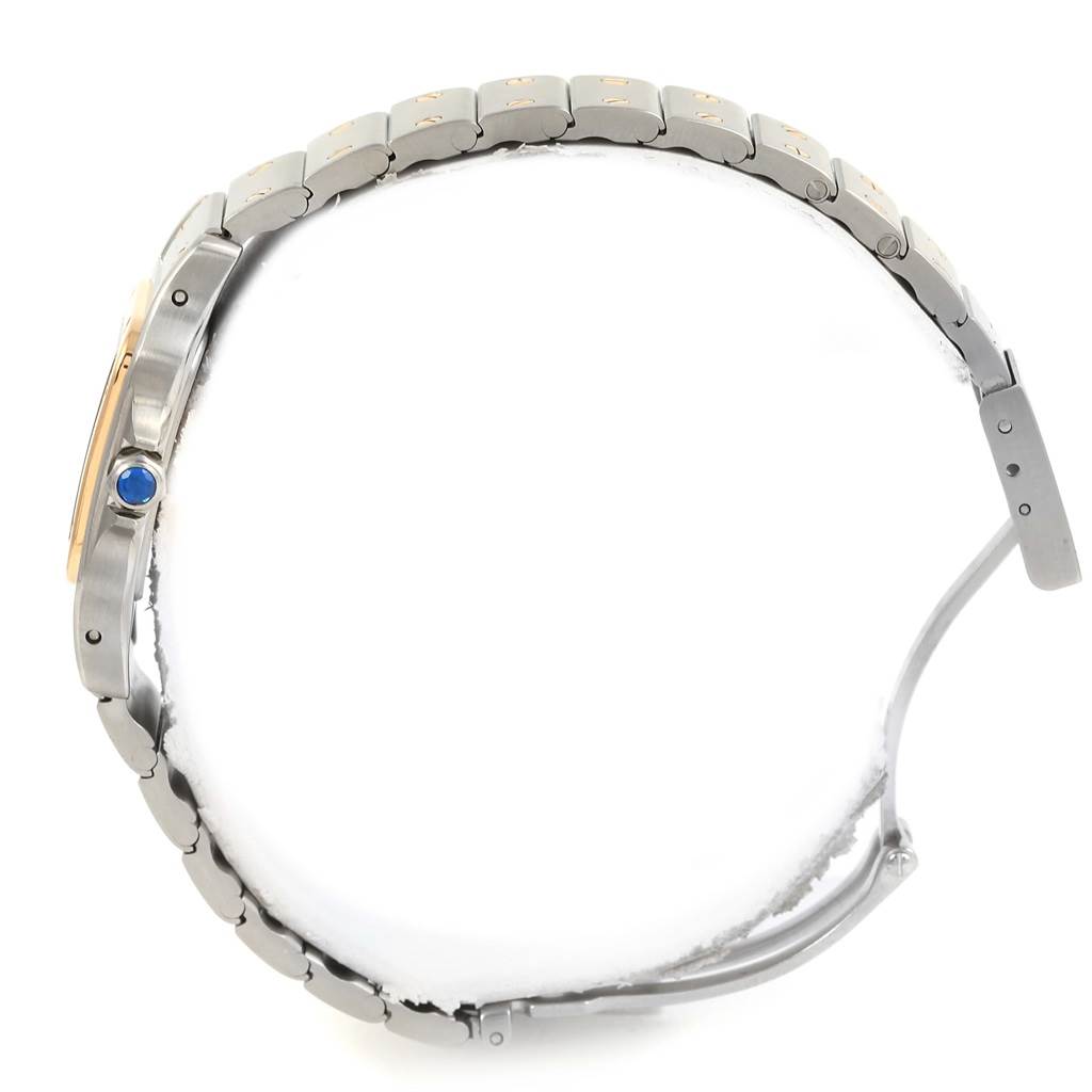 The image shows a side view of a Santos model watch by Cartier, highlighting its bracelet, case, and crown.