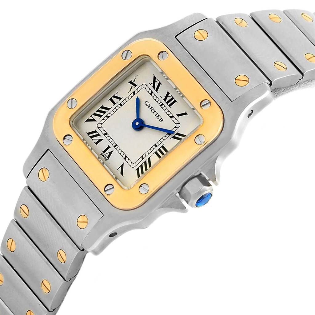 This Cartier Santos 1057930 Women
s Stainless Steel Silver Dial 1057930 Women
s Stainless Steel Silver Dial watch is shown from an angled view, highlighting the face, bezel, and part of the bracelet.