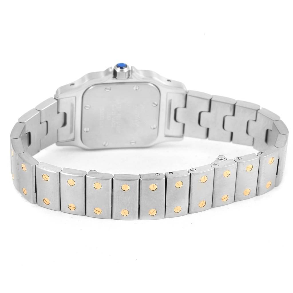 This image shows the back view of the Santos model watch by Cartier, highlighting the bracelet and clasp.