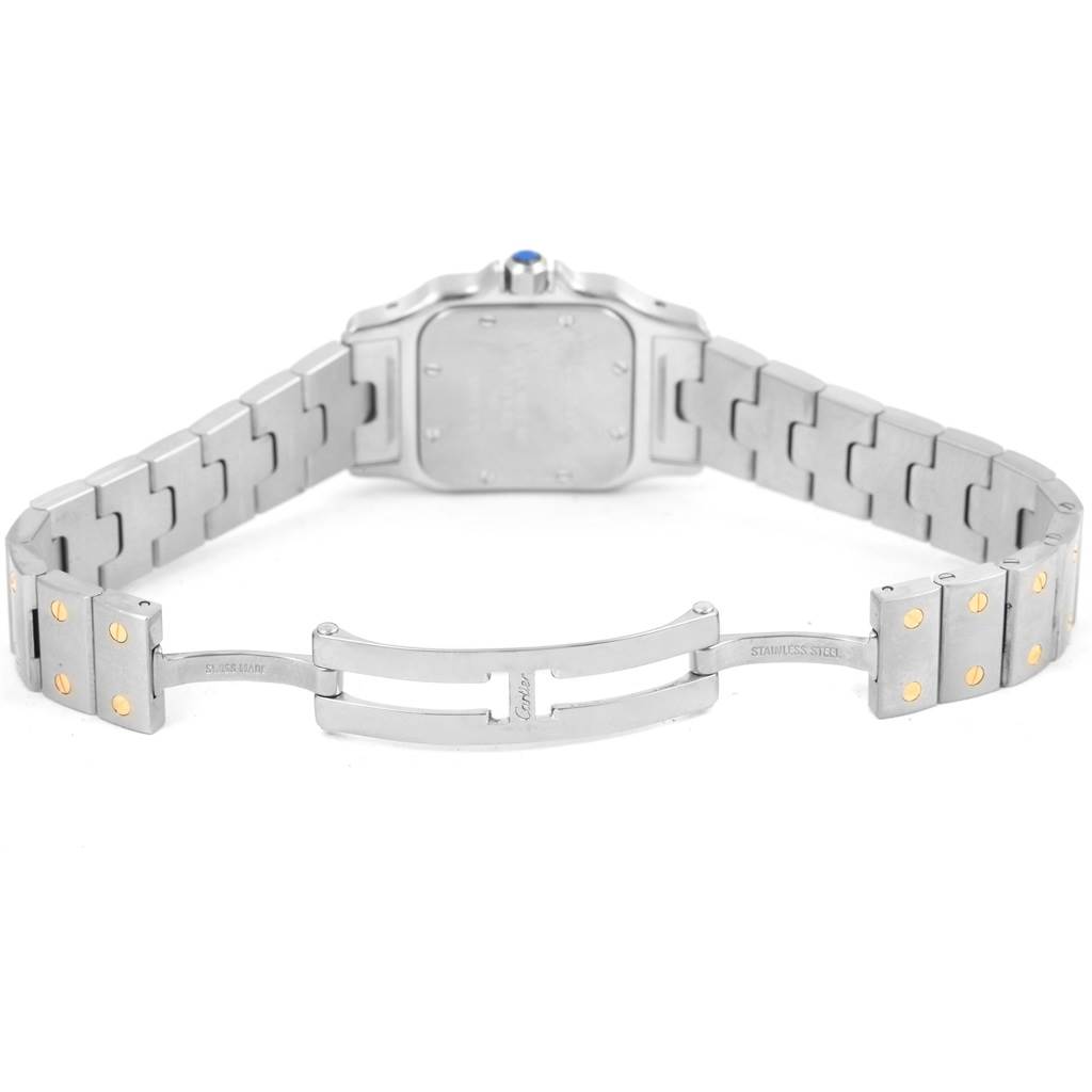 The image shows the Santos model by Cartier viewed from the back, displaying its open stainless steel bracelet and clasp.